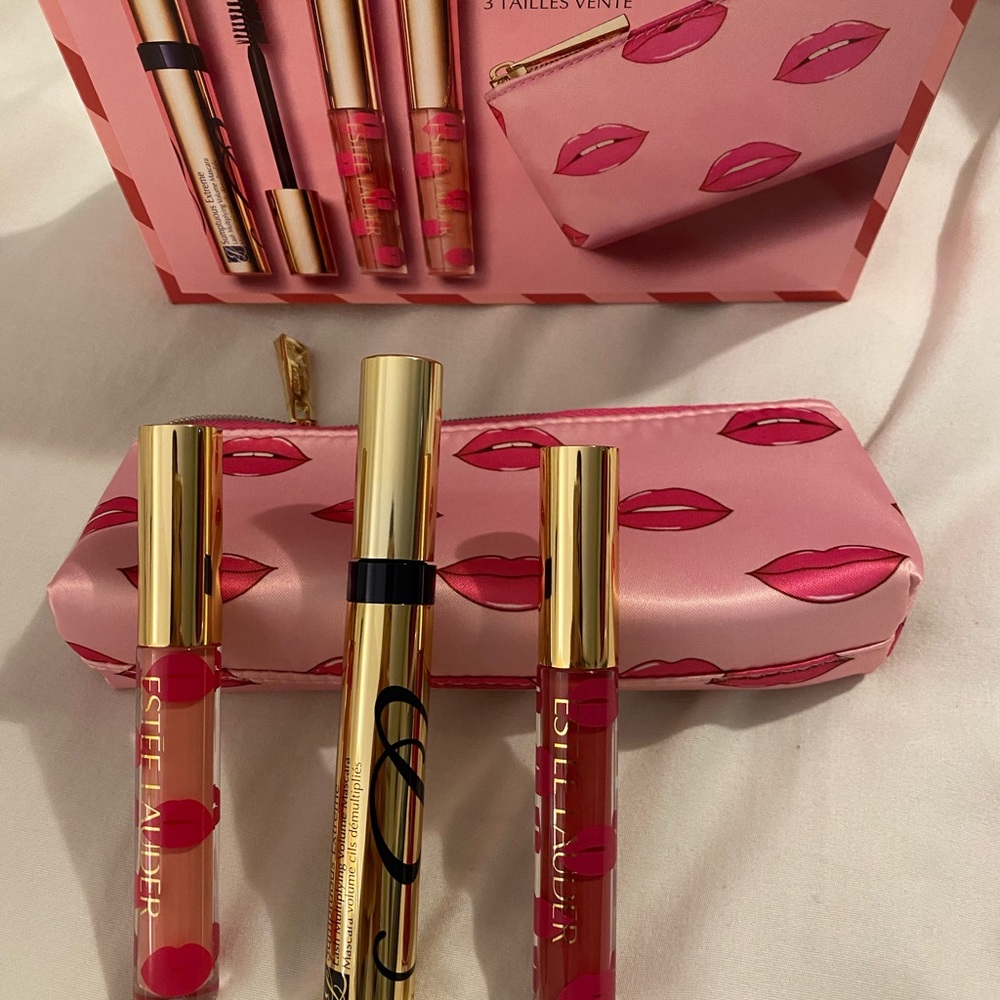 Set of two lipgloss, black mascara and cute little makeup bag